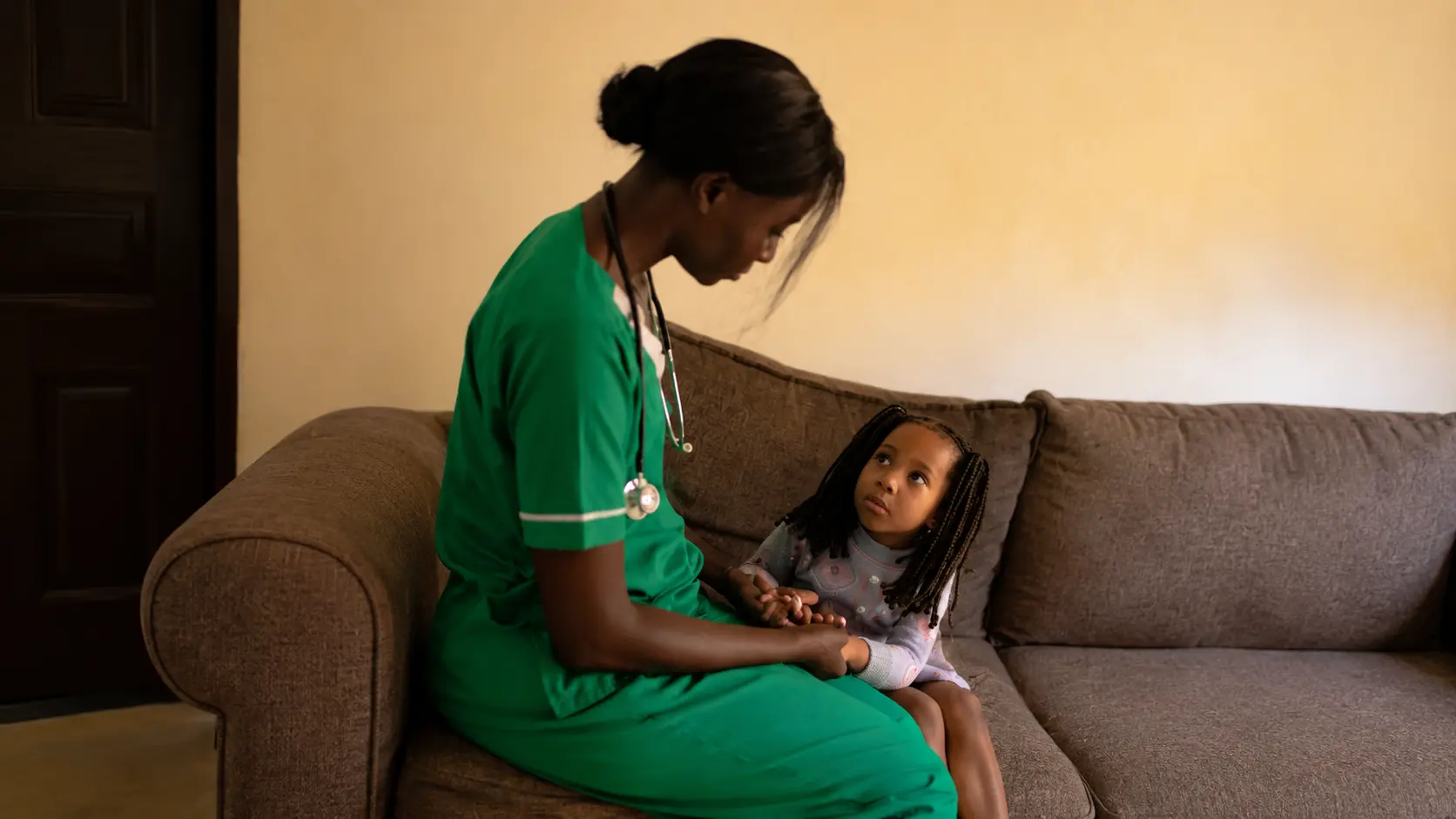 A doctor talking to a child